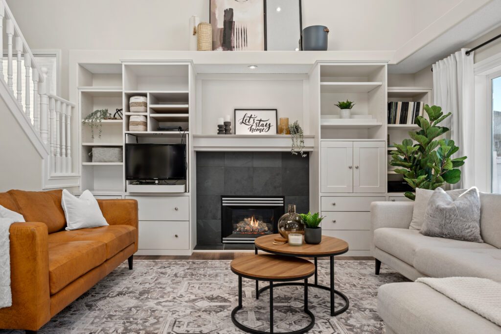 Decorated living room with balanced furniture layout, layered textiles, and neutral styling