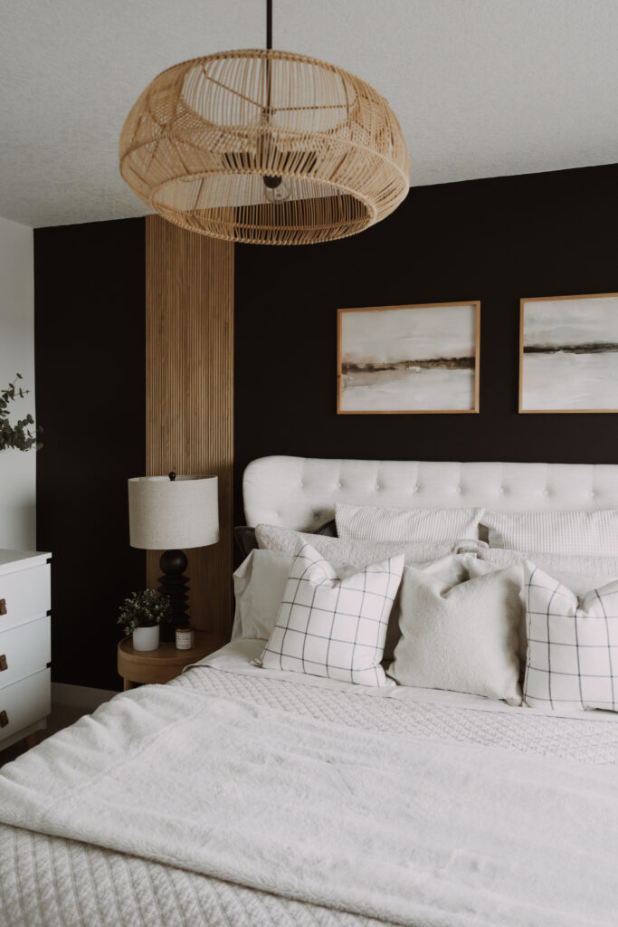 Styled bedroom with layered textiles, neutral palette, and refined furniture placement