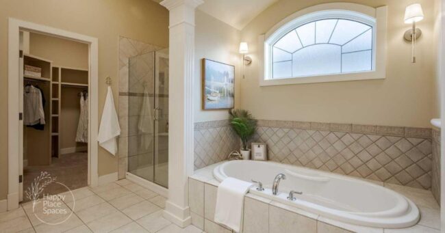 Staged bathroom with neutral décor, fresh white towels, and minimal accessories creating a clean, move-in-ready look.