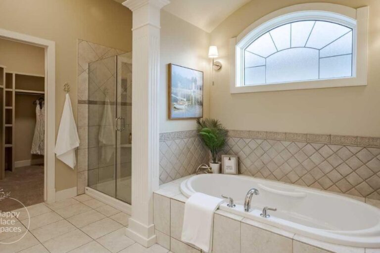 Staged bathroom with neutral décor, fresh white towels, and minimal accessories creating a clean, move-in-ready look.